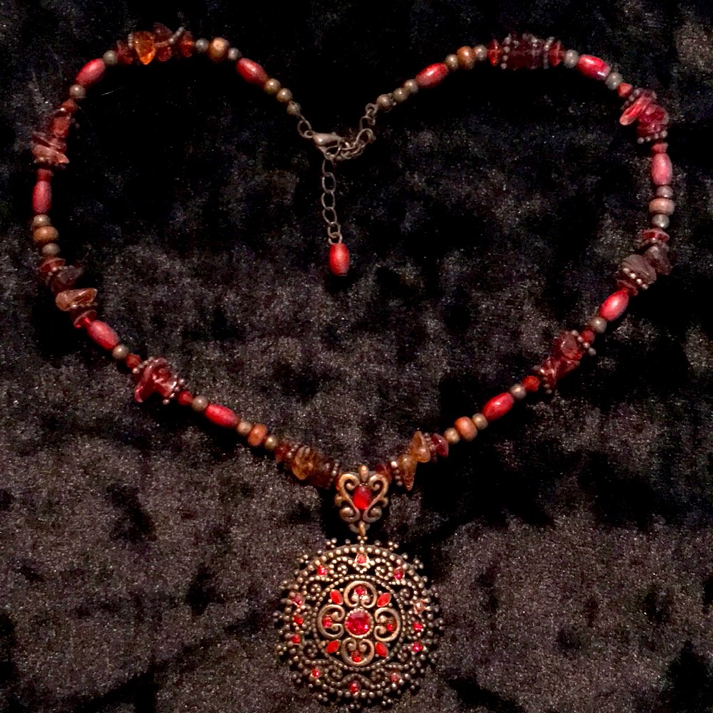 Vintage look red rhinestone and bronze medallion necklace